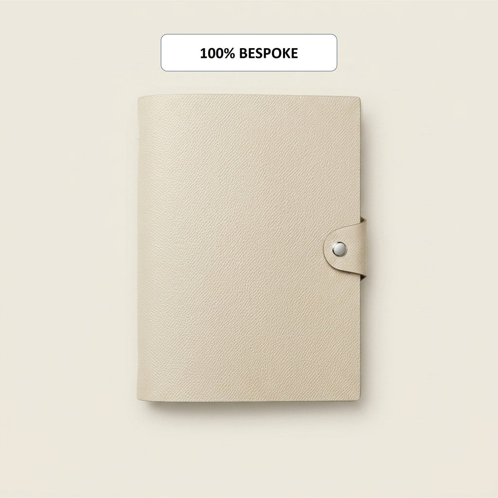 Bespoke cream German Noblessa leather A5 journal cover with snap closure
