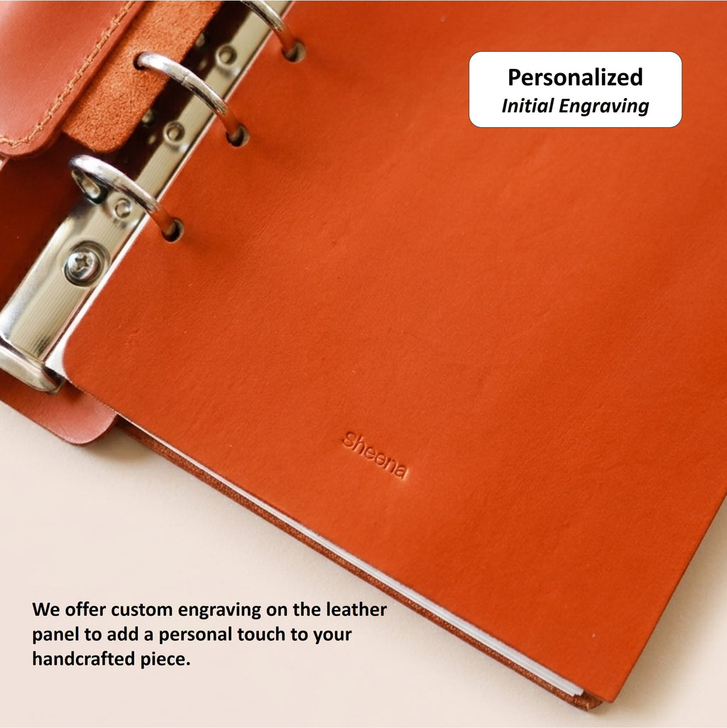 Personalized initial engraving on the interior leather panel of an A6 journal cover
