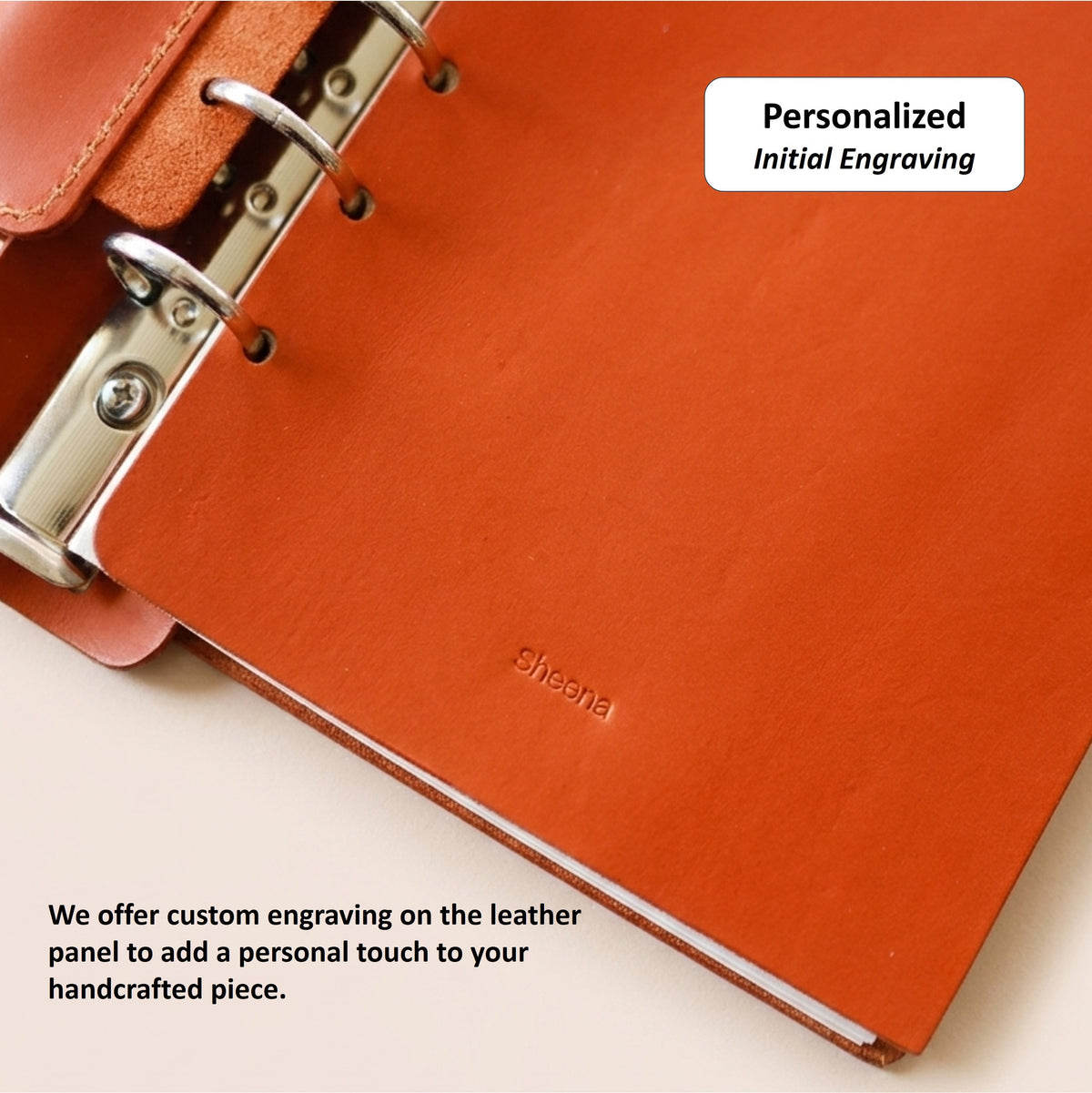 Personalized initial engraving on the interior leather panel of an A6 journal cover
