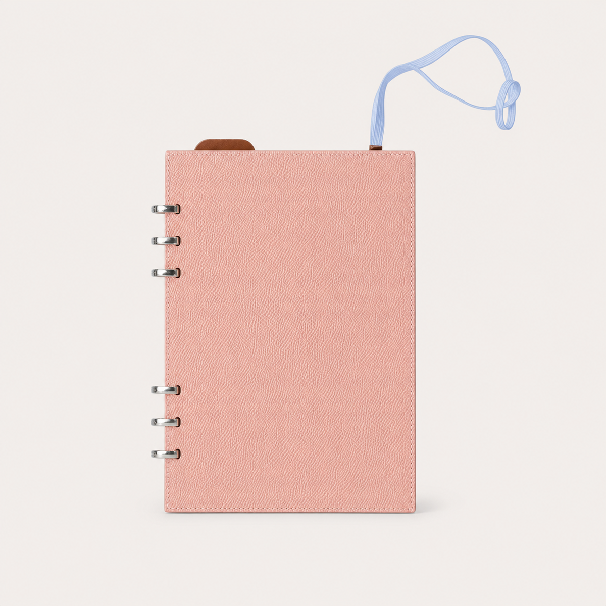 Blush pink A5 binder with a detachable light blue elastic band closure panel