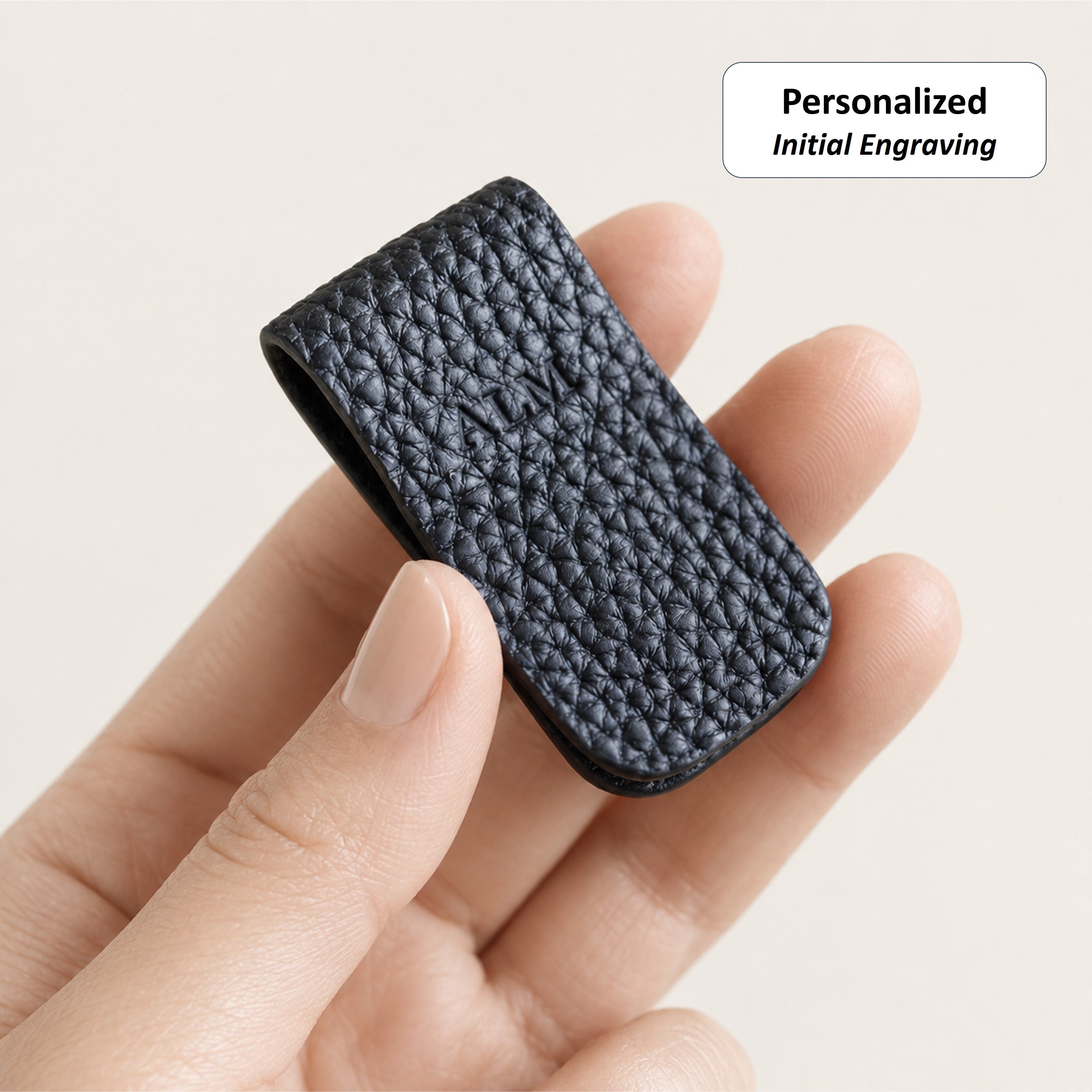 Optional initial engraving on a Dark Navy German Togo leather Cord Wrap.