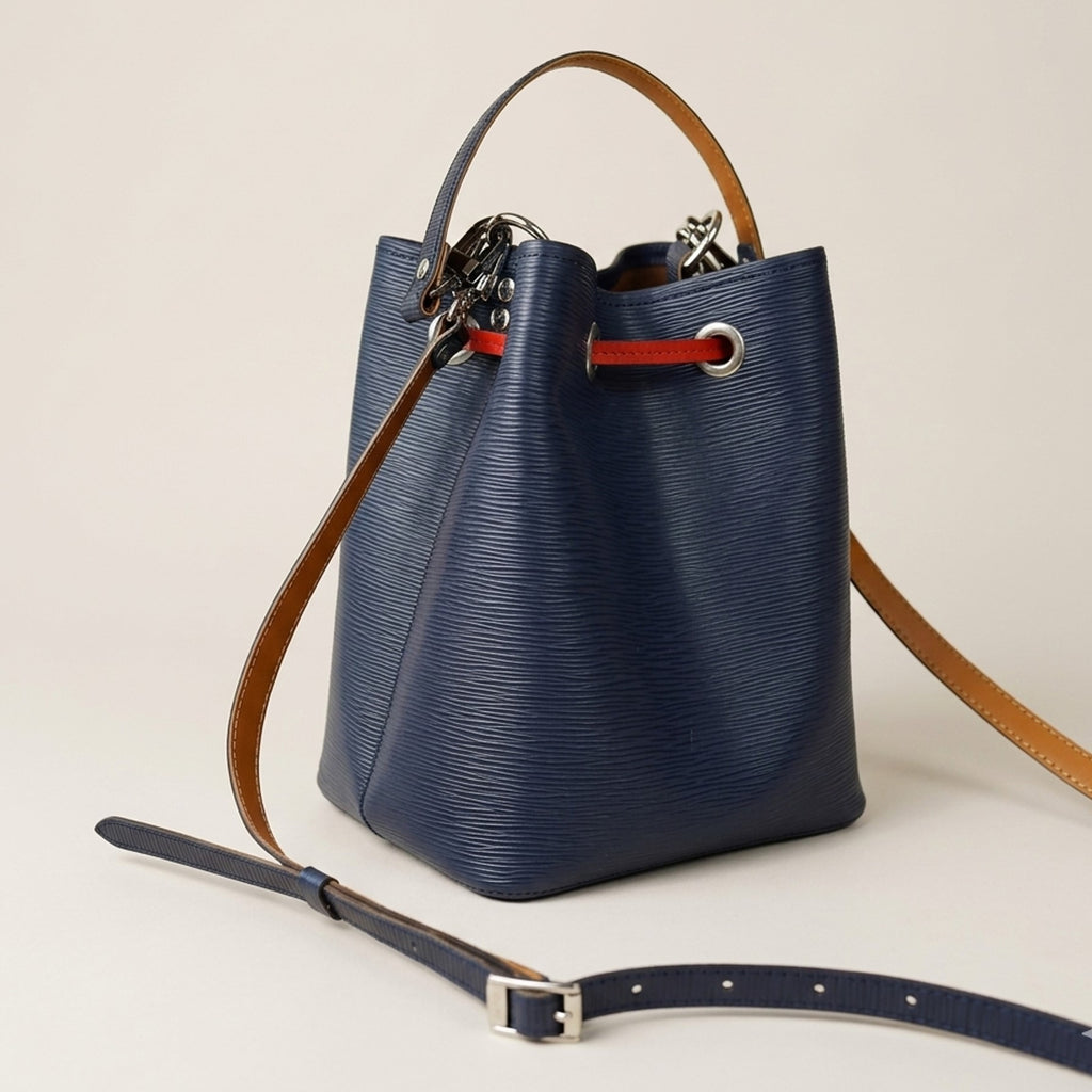 Side view of the Dorothy Mini Bag showing its structured bucket silhouette