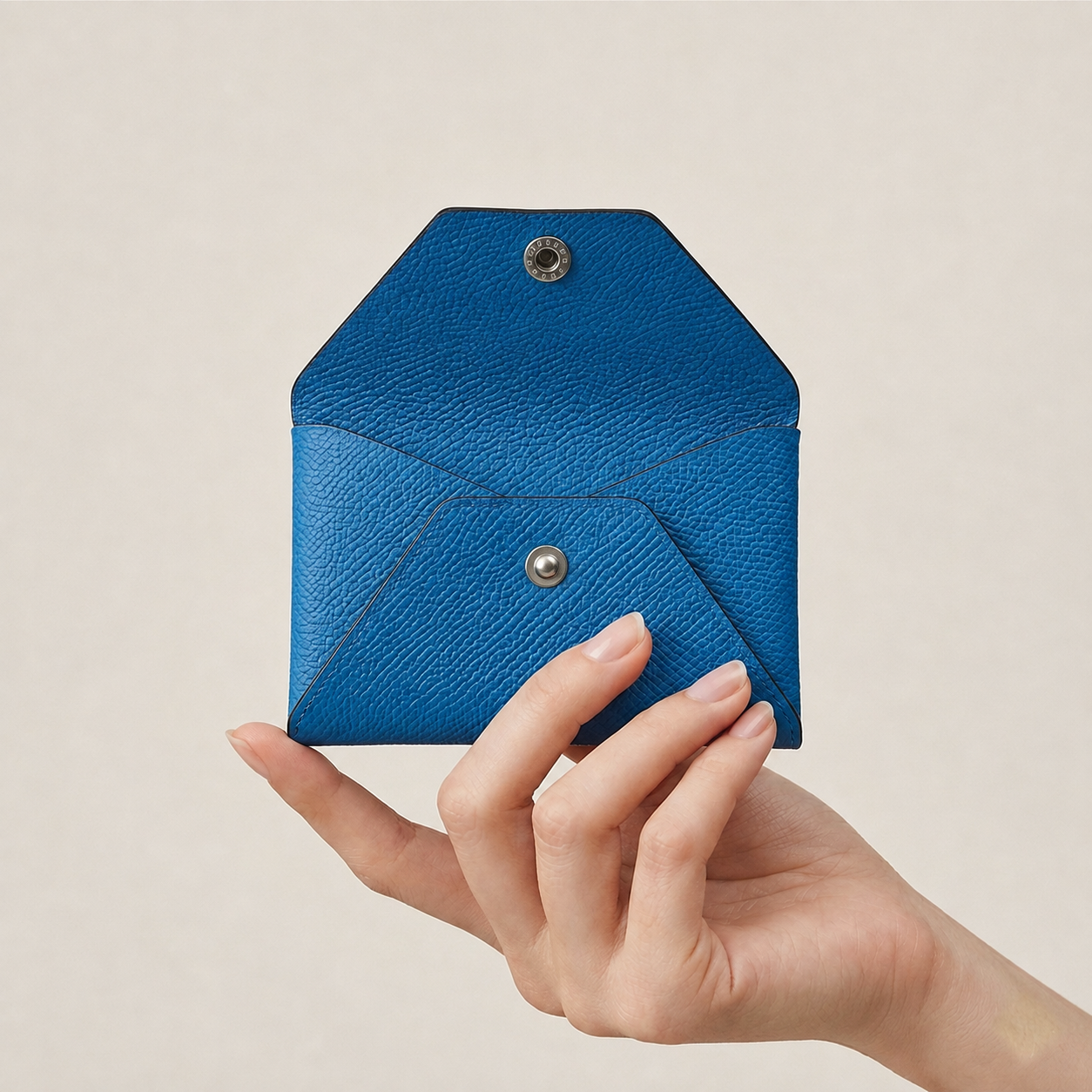 Zanzibar Macaron Edge card wallet in German Noblessa leather shown open in hand
