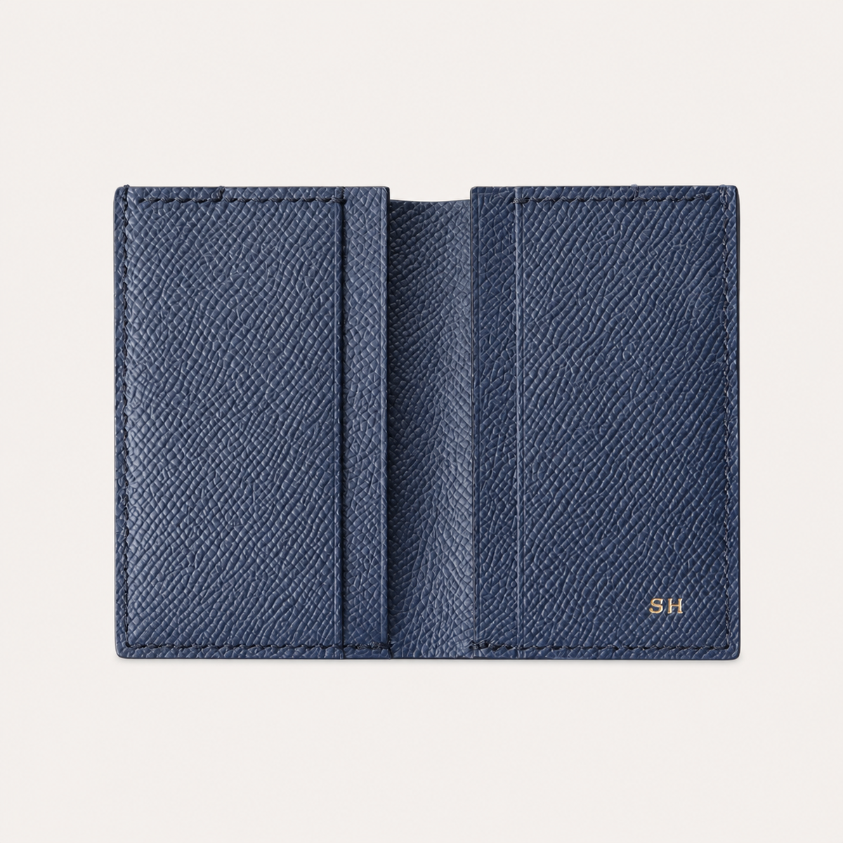 Open navy Tyrian Minimal Wallet showing its card slots and lined interior