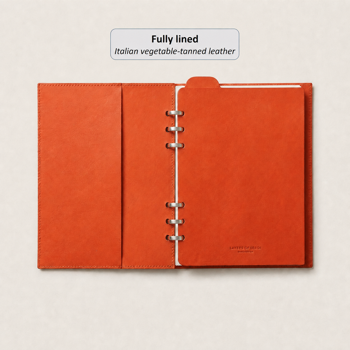 Fully lined orange Vacchetta leather interior with a silver Smart Ring mechanism