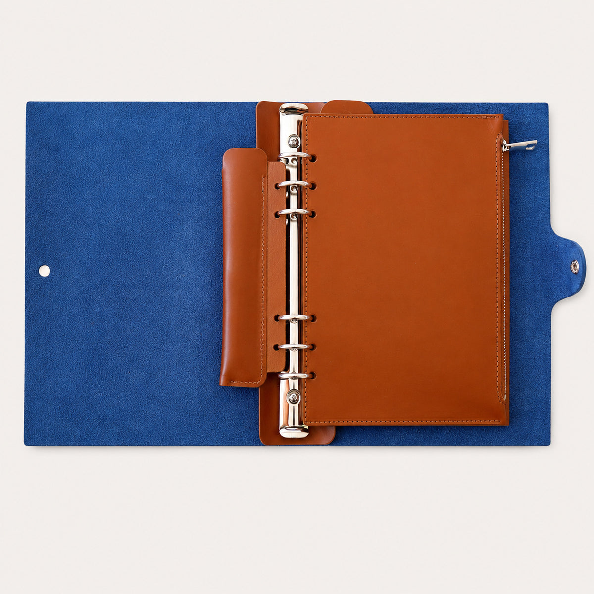 Tan detachable leather zip pocket installed inside a Layers of LeRoi six-ring journal cover