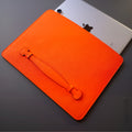 Orange German Noblessa leather iPad sleeve with Lift & Restore handle, angled front view