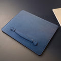 Navy German Noblessa leather MacBook sleeve with Lift & Restore handle, angled front view