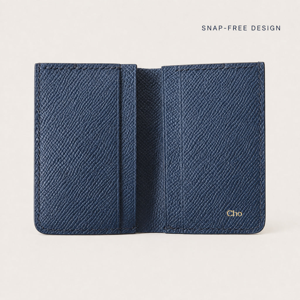 Open navy Tyrian Minimal Wallet showing its fully lined interior