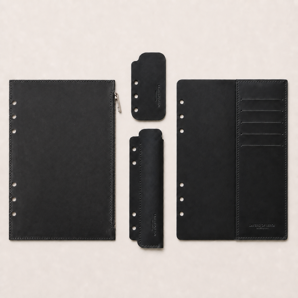 Black four-piece Italian Vacchetta leather accessory set for a Layers of LeRoi ring journal cover