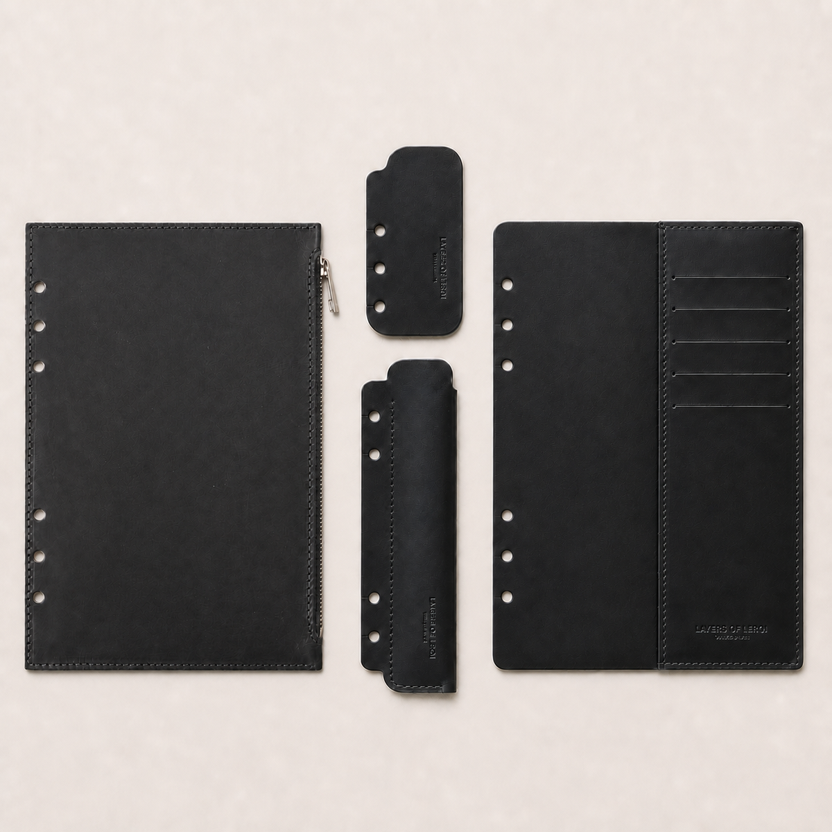 Black four-piece Italian Vacchetta leather accessory set for a Layers of LeRoi ring journal cover