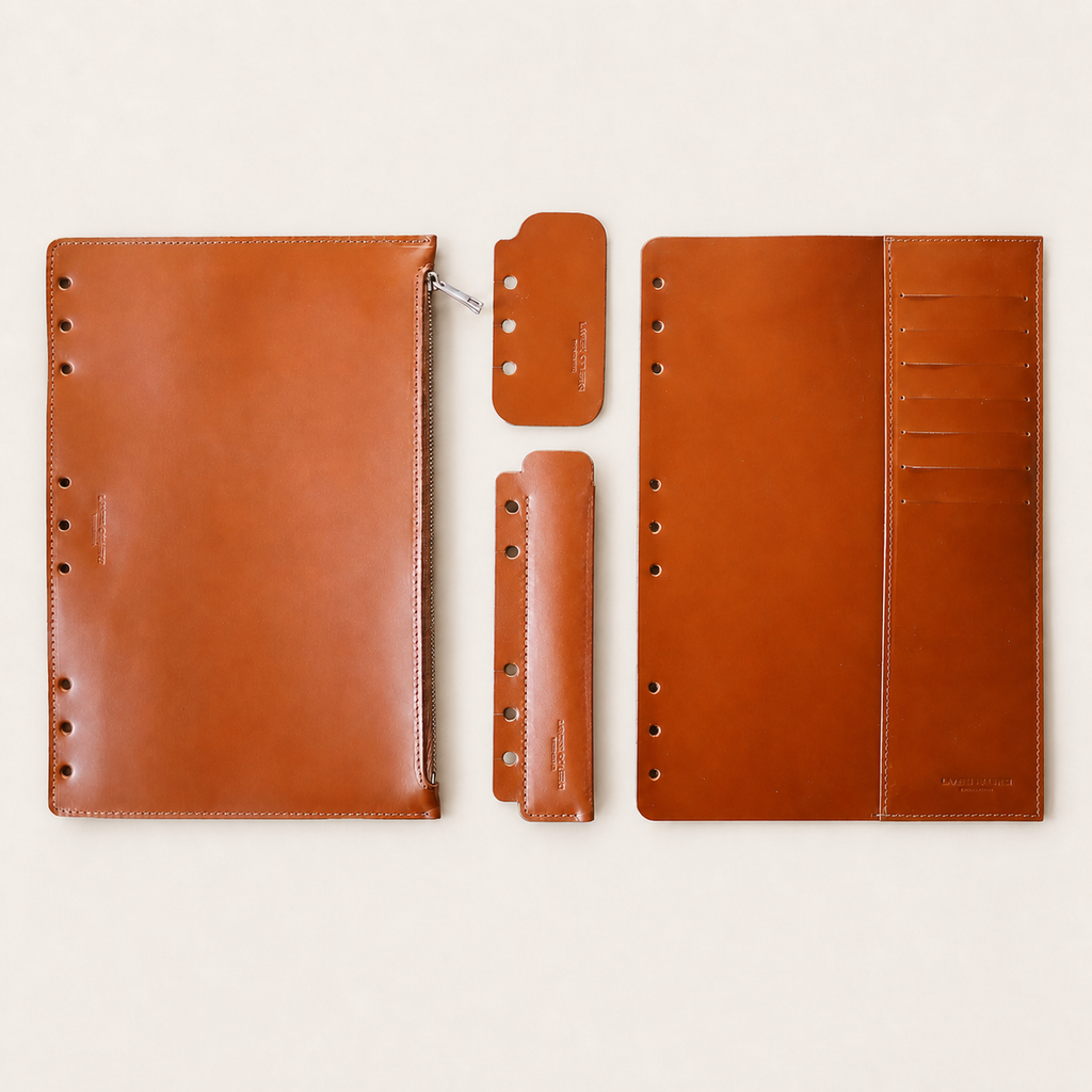 Tan four-piece Italian Vacchetta leather accessory set for a Layers of LeRoi ring journal cover